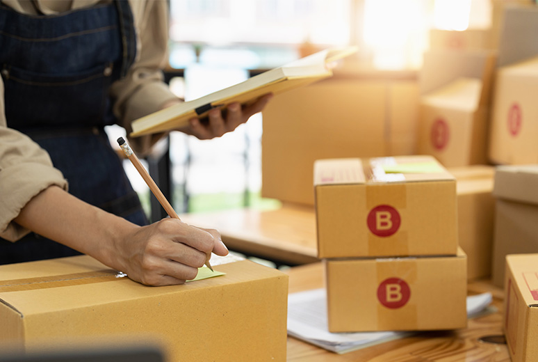 Kakobuy official shipping illustration showing a worker checking parcels